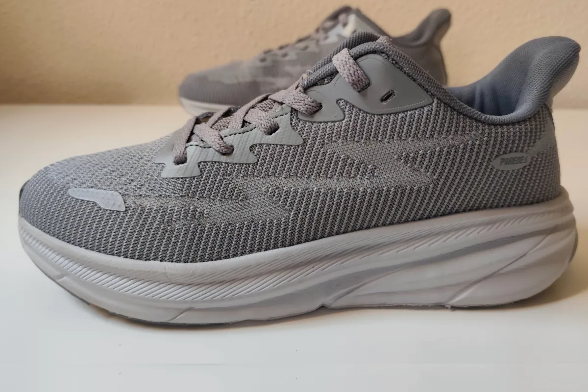 Clean grey mesh sneakers viewed from above after machine washing showing restored colour