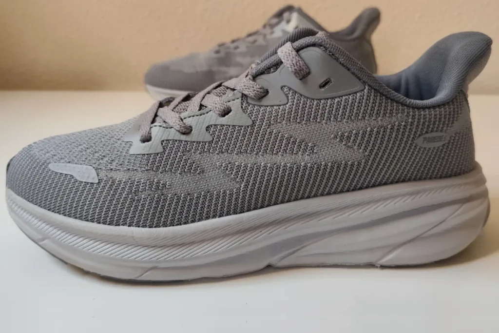 Clean grey mesh sneakers viewed from above after machine washing showing restored colour