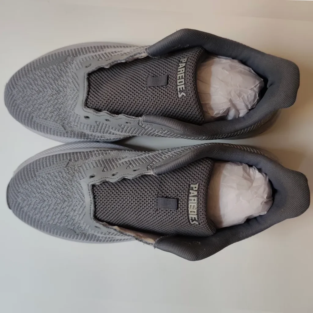 How to dry sneakers fast clean grey mesh running shoe top view after machine washing showing bright white midsole restored